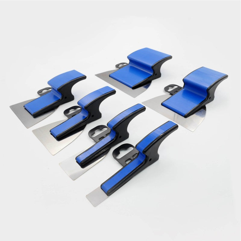 A set of six Refina Superskim Mini Ergo Superflex Skimming Spatulas in various sizes with stainless steel flexible blades and blue plastic handles.