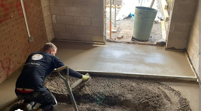 traditional floor screed being layed with a floor screeding rule