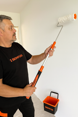 applying plaster with fully extended plaster roller from skimflex