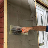 Person applying plaster to a wall using a Skimflex 007 trowel