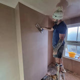 plasterer skimming a wall with the refina superflex trowel